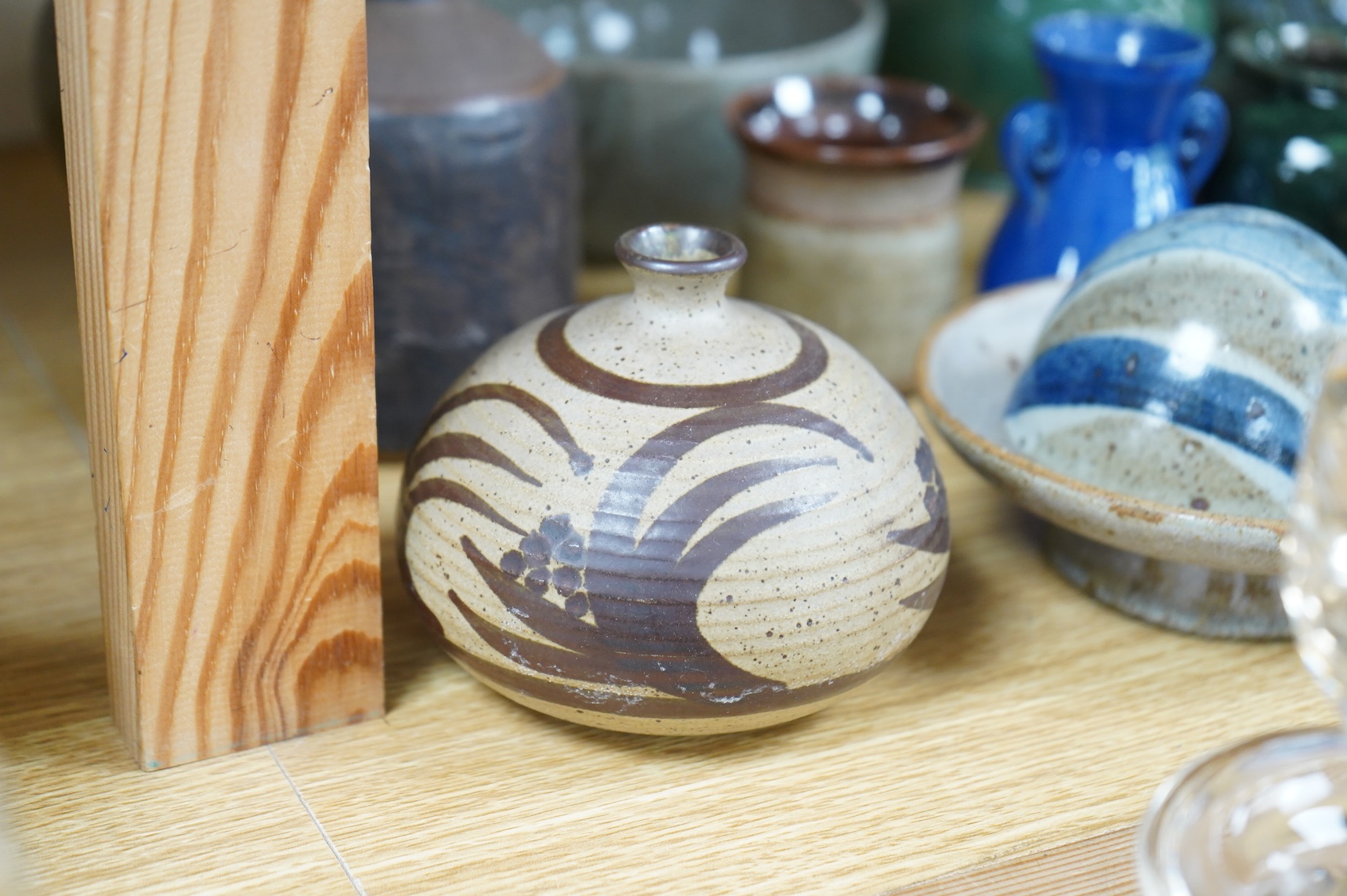 A collection of studio pottery to include a small Danish squat vase, a Brannam, Devon vase and three small Dickerware pieces, largest 13cm high